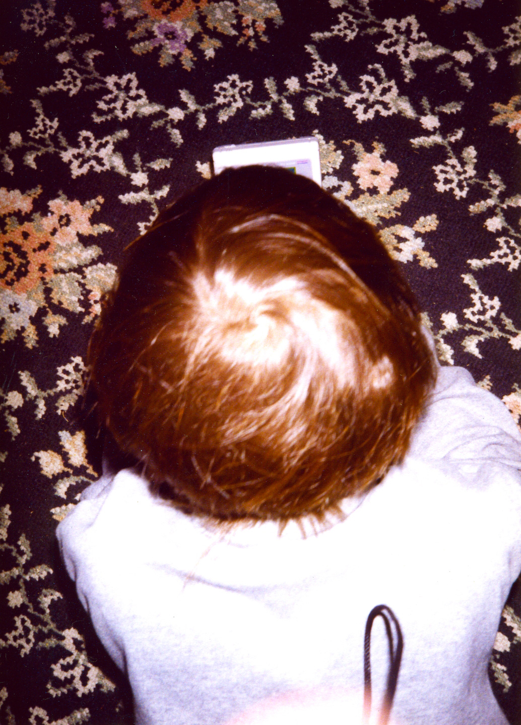 Photo of me at age five, playing Gameboy.